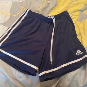 Adidas blue shorts with white trim